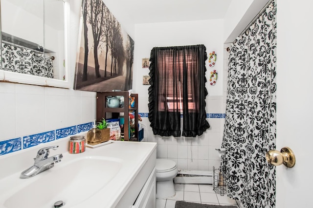 3650 Waldo Ave Unit 2, Bronx, NY 10463 - full bath featuring tile walls, tile patterned flooring, vanity, curtained shower, and a baseboard heating unit