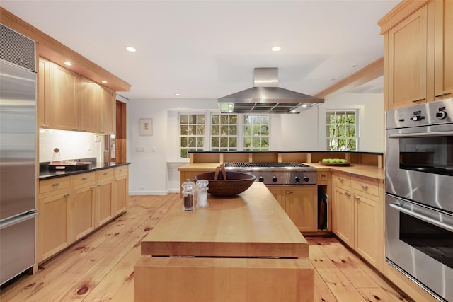 27 Dingle Ridge Rd, North Salem, NY 10560 - kitchen featuring wooden counters, island range hood, stainless steel appliances, light brown cabinetry, and recessed lighting