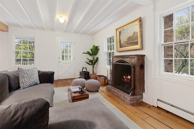 27 Dingle Ridge Rd, North Salem, NY 10560 - living room with light wood-type flooring, a high end fireplace, a baseboard radiator, and beam ceiling