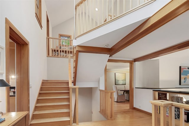 27 Dingle Ridge Rd, North Salem, NY 10560 - staircase featuring wood finished floors and vaulted ceiling