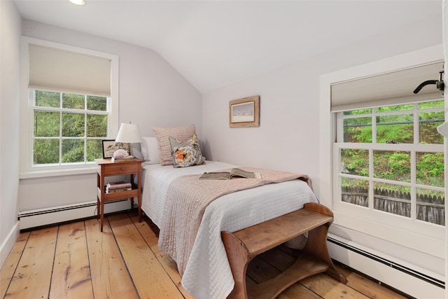 27 Dingle Ridge Rd, North Salem, NY 10560 - bedroom with baseboard heating, vaulted ceiling, light wood finished floors, and multiple windows