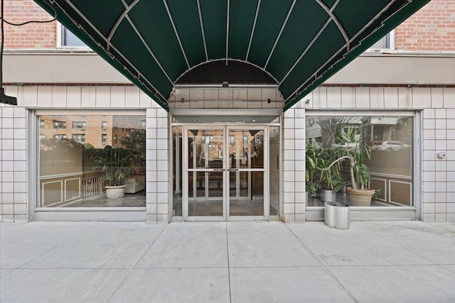 property entrance with a patio area