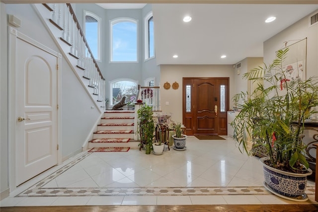 8 Percheron Ln, Roslyn Heights, NY 11577 - foyer entrance with recessed lighting, stairs, light tile patterned floors, baseboards, and visible vents