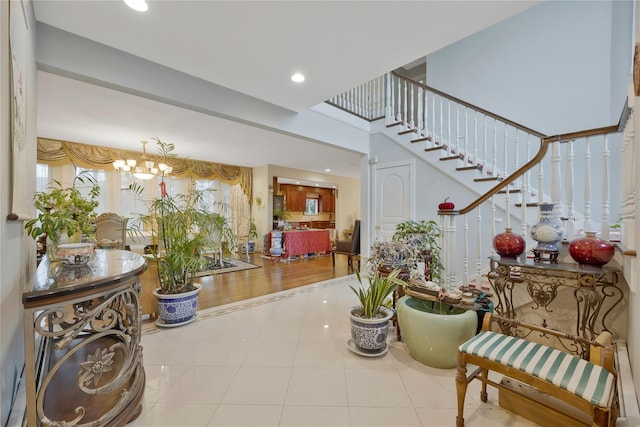 8 Percheron Ln, Roslyn Heights, NY 11577 - foyer featuring tile patterned floors, recessed lighting, an inviting chandelier, and stairs