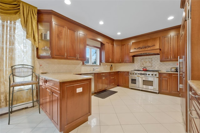 8 Percheron Ln, Roslyn Heights, NY 11577 - kitchen with a sink, stainless steel appliances, custom exhaust hood, a peninsula, and brown cabinetry