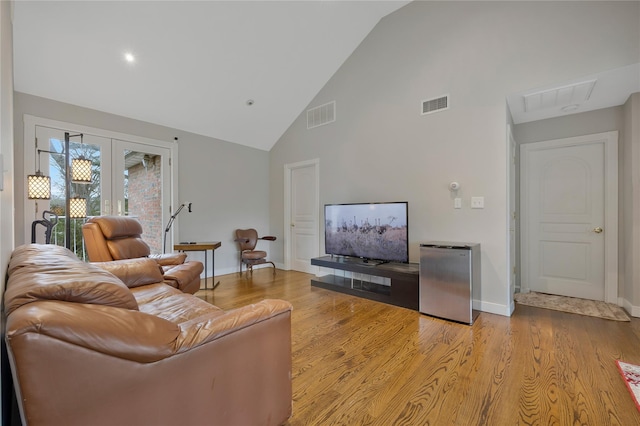 8 Percheron Ln, Roslyn Heights, NY 11577 - living room with visible vents, french doors, high vaulted ceiling, and baseboards