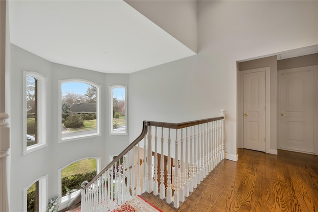 8 Percheron Ln, Roslyn Heights, NY 11577 - corridor featuring a high ceiling, an upstairs landing, and wood finished floors
