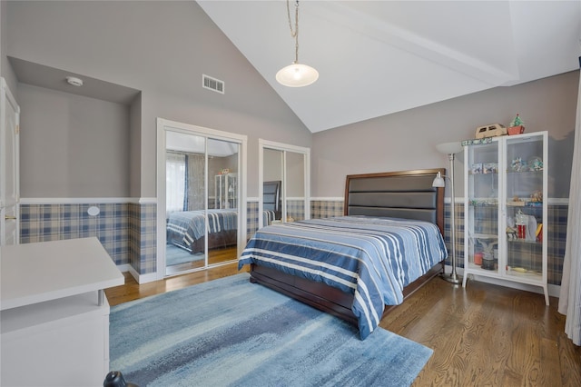 8 Percheron Ln, Roslyn Heights, NY 11577 - bedroom featuring multiple closets, wainscoting, wood finished floors, and visible vents