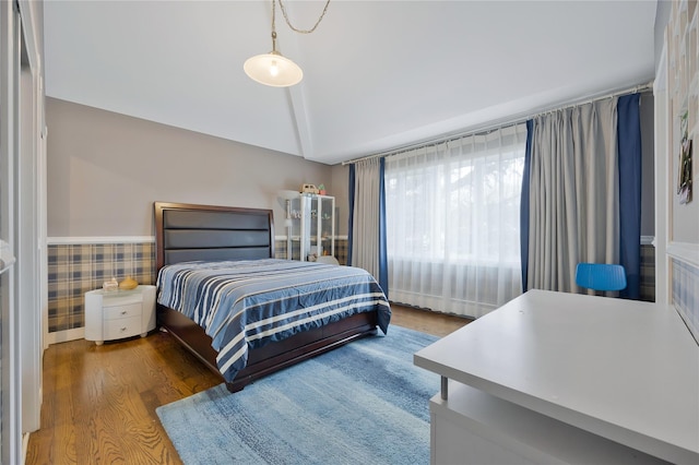 8 Percheron Ln, Roslyn Heights, NY 11577 - bedroom with wood finished floors, a wainscoted wall, and lofted ceiling