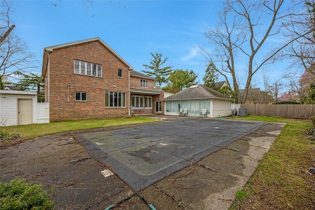 8 Percheron Ln, Roslyn Heights, NY 11577 - rear view of property with a patio, fence, a lawn, and brick siding