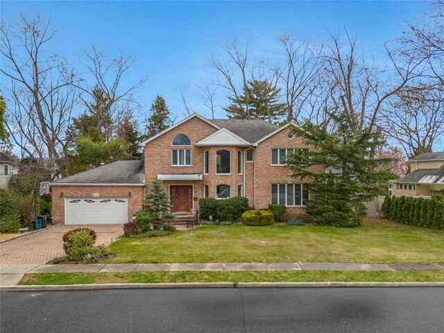 8 Percheron Ln, Roslyn Heights, NY 11577 - traditional-style home with a garage, brick siding, decorative driveway, and a front yard
