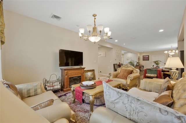 8 Percheron Ln, Roslyn Heights, NY 11577 - living area with visible vents, recessed lighting, a notable chandelier, and a glass covered fireplace