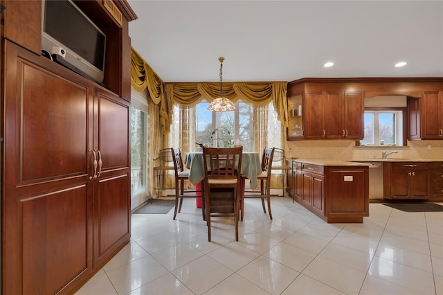 8 Percheron Ln, Roslyn Heights, NY 11577 - kitchen with recessed lighting, decorative light fixtures, light countertops, backsplash, and a notable chandelier
