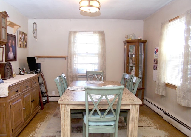 dining area featuring baseboard heating and a healthy amount of sunlight