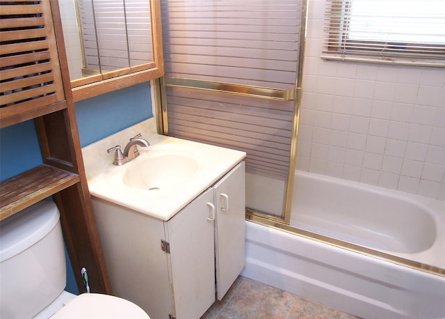 bathroom featuring toilet, shower / washtub combination, and vanity