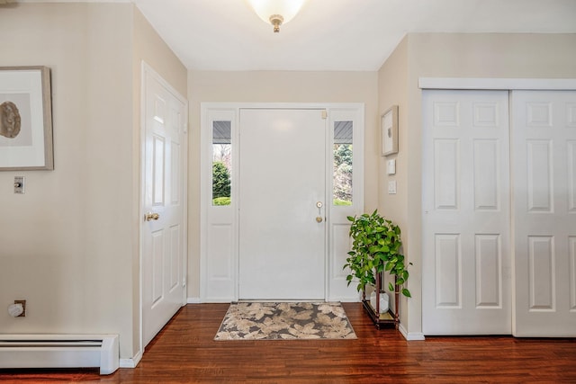 entrance foyer with baseboard heating, baseboards, and dark wood-style floors