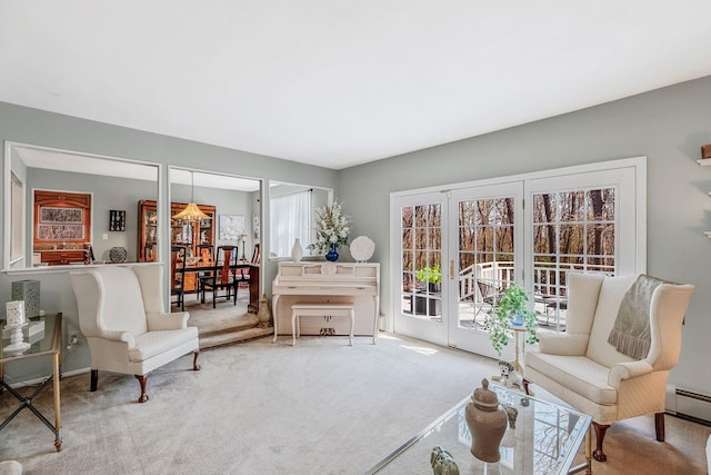 living area featuring carpet floors, baseboards, and baseboard heating