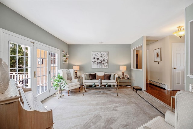 living room with a baseboard radiator and wood finished floors