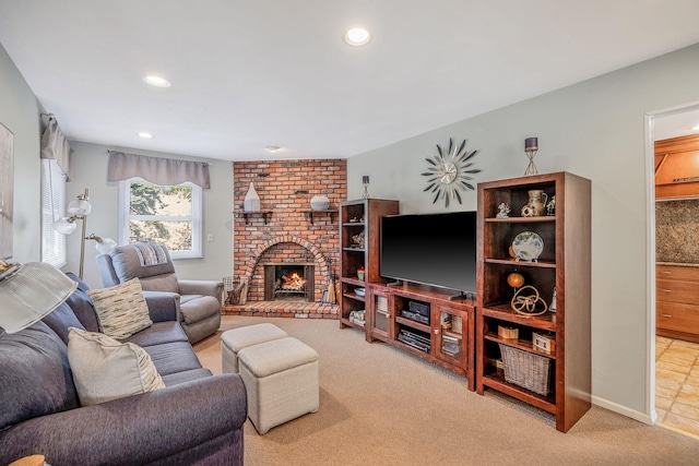 carpeted living room featuring baseboards, a brick fireplace, and recessed lighting
