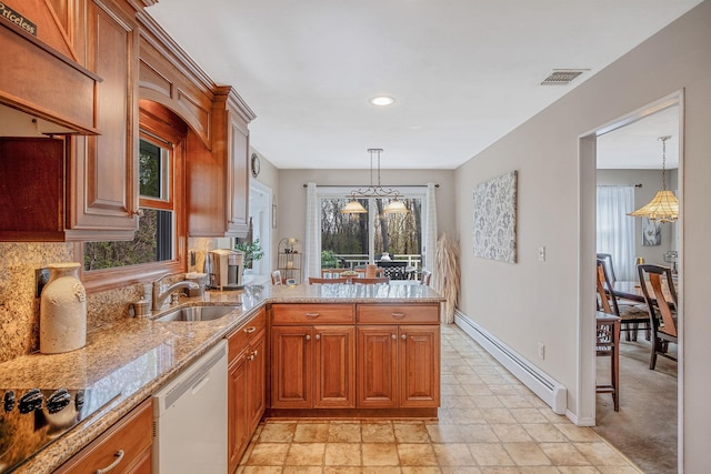 kitchen featuring light stone counters, a peninsula, black electric cooktop, dishwasher, and a baseboard radiator