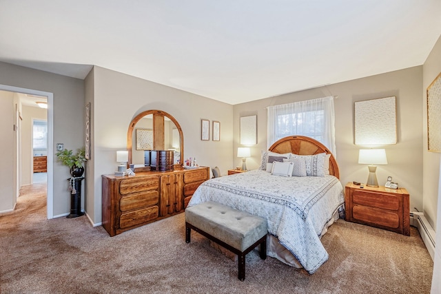carpeted bedroom with baseboard heating, baseboards, and multiple windows
