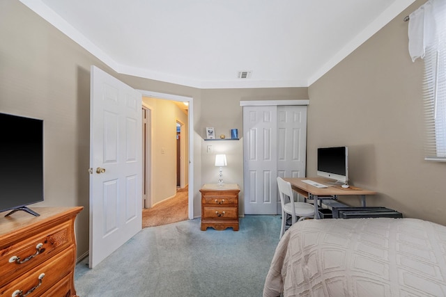 bedroom with a closet, carpet flooring, and visible vents