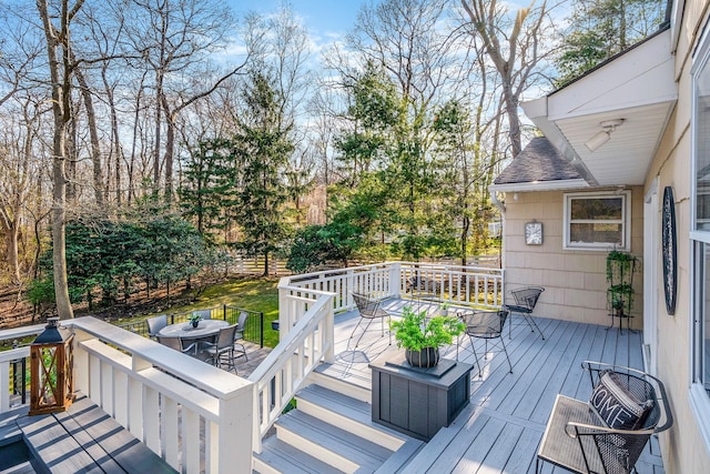 wooden terrace with outdoor dining area