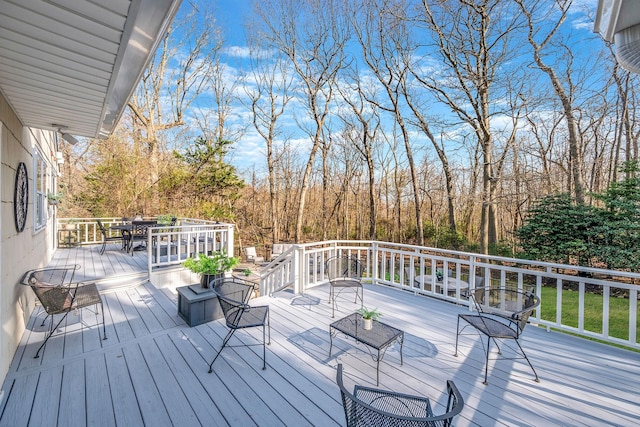 deck featuring outdoor dining area