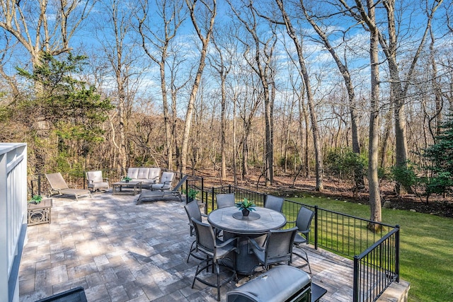 view of patio featuring a deck, an outdoor hangout area, and outdoor dining area