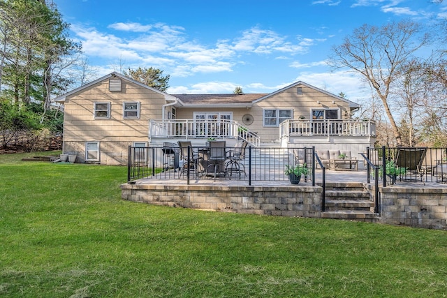 rear view of property with stairway, a wooden deck, a patio, and a lawn