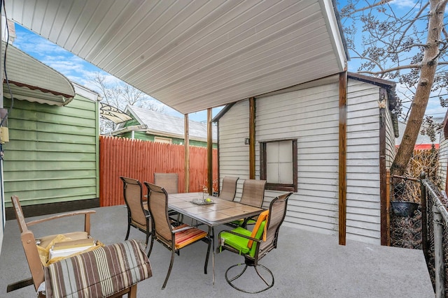 view of patio with fence and outdoor dining space