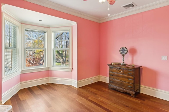 spare room featuring ceiling fan, baseboards, visible vents, and wood finished floors