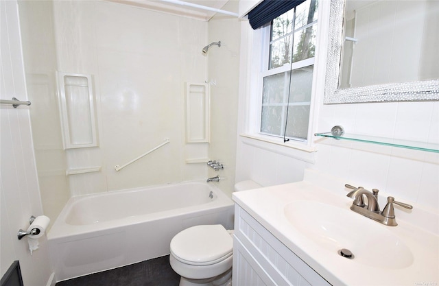 bathroom featuring vanity, shower / tub combination, and toilet