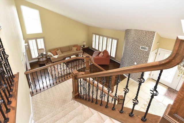 staircase with visible vents and a wealth of natural light