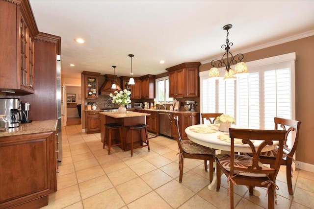 dining area with light tile patterned floors, ornamental molding, and recessed lighting