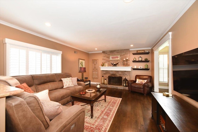 living room with recessed lighting, dark wood-style flooring, a stone fireplace, and ornamental molding