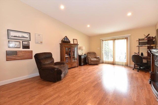 sitting room featuring baseboards, recessed lighting, light wood-style floors, and lofted ceiling