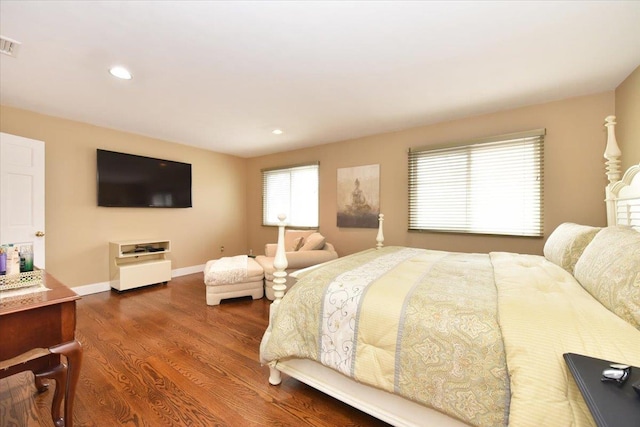 bedroom with recessed lighting, dark wood-style flooring, baseboards, and visible vents
