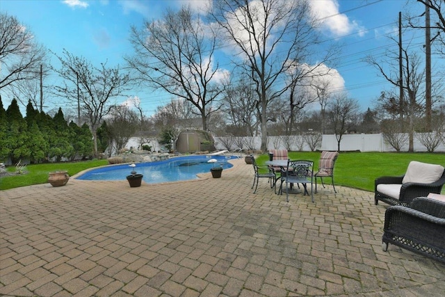 view of pool with a fenced in pool, a yard, a patio area, and a fenced backyard