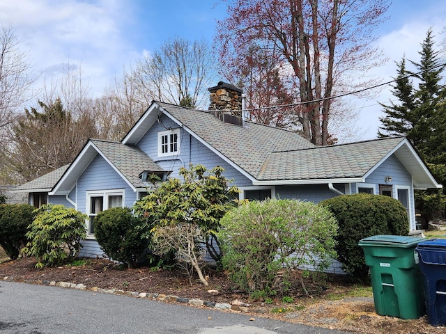 view of home's exterior with a chimney