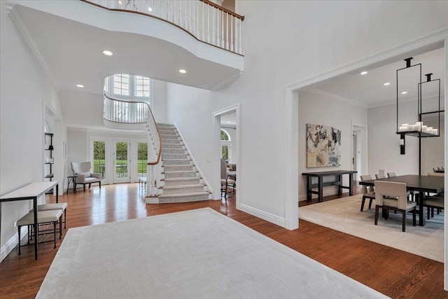 30 Morris Ln, Scarsdale, NY 10583 - entrance foyer featuring a high ceiling, crown molding, wood finished floors, and baseboards