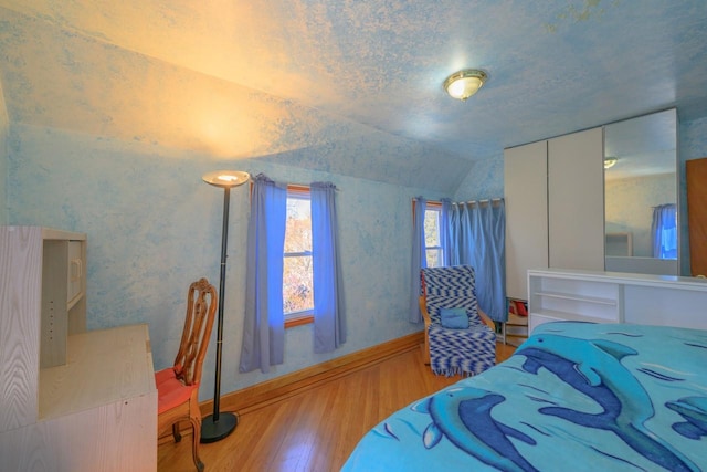 193-21 109th Rd, Saint Albans, NY 11412 - bedroom featuring vaulted ceiling, wood finished floors, and baseboards