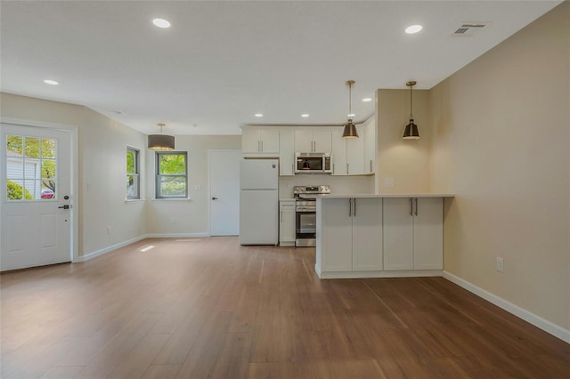 122 Knolls Dr Unit 122, Stony Brook, NY 11790 - kitchen featuring baseboards, appliances with stainless steel finishes, and wood finished floors