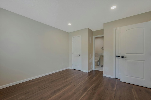 122 Knolls Dr Unit 122, Stony Brook, NY 11790 - unfurnished bedroom featuring baseboards, recessed lighting, dark wood finished floors, and connected bathroom