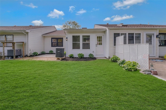 122 Knolls Dr Unit 122, Stony Brook, NY 11790 - rear view of property with a yard, a patio, and cooling unit