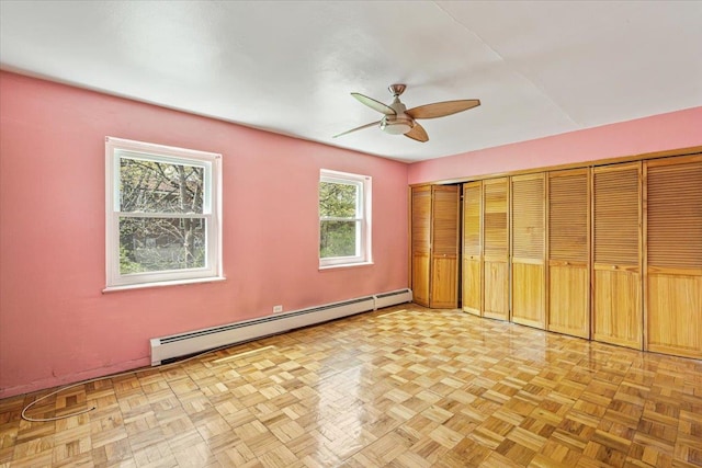 unfurnished bedroom featuring a baseboard radiator and a ceiling fan