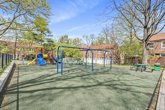 community jungle gym featuring fence