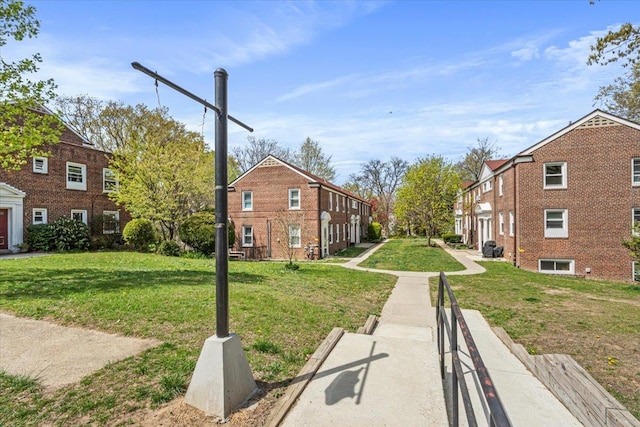 view of home's community with a residential view and a yard