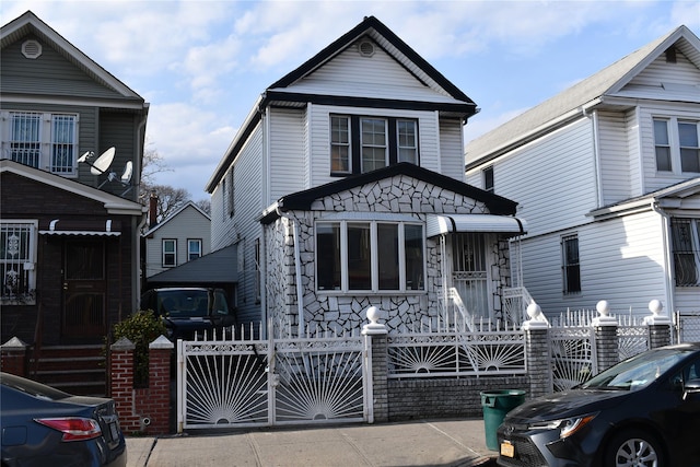 139-15 89th Ave, Briarwood, NY 11435 - view of front of house featuring a gate and a fenced front yard