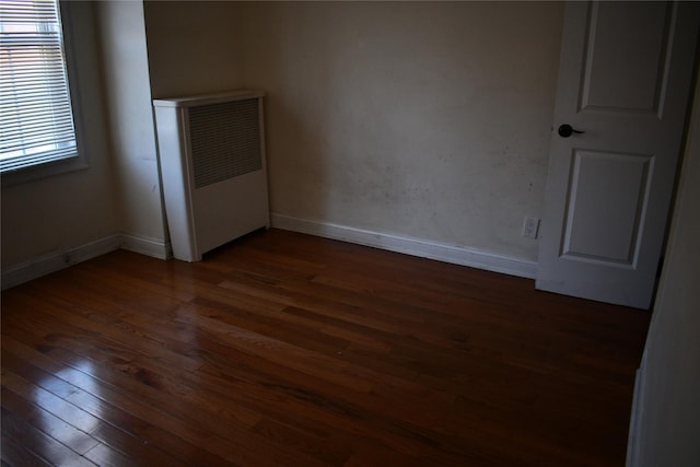 139-15 89th Ave, Briarwood, NY 11435 - spare room with dark wood-style floors and baseboards